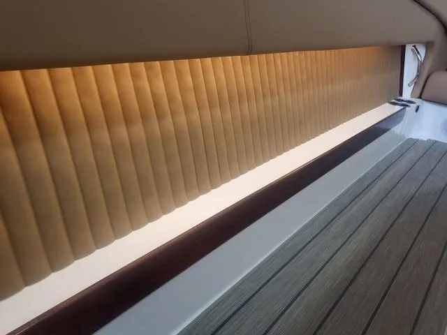 Slide: The Image of 2024 Thoroughbred u23i interior with elegant pleated blinds and sleek flooring. - 15