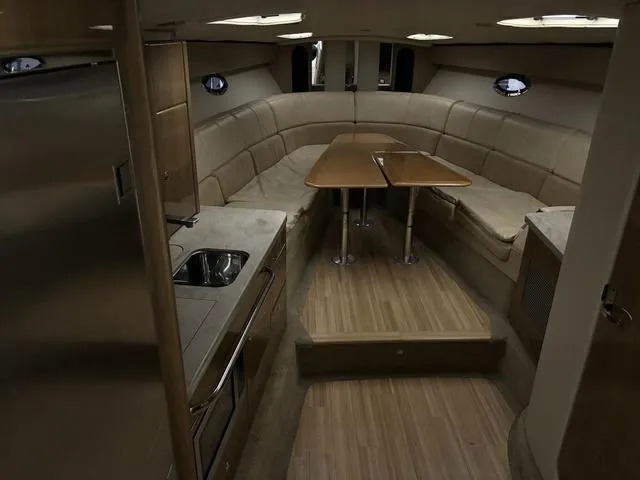 Slide: The Image of Interior of 2015 Formula Boats 400 Super Sport with seating and kitchenette. - 12