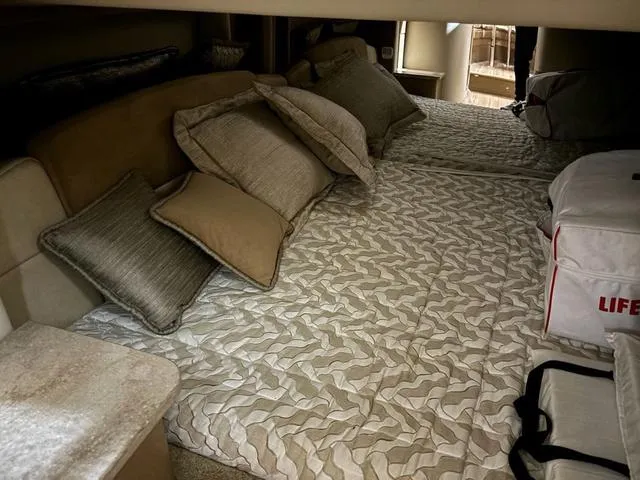 Slide: The Image of Interior cabin of 2015 Formula Boats 400 Super Sport with cozy bedding and pillows. - 16