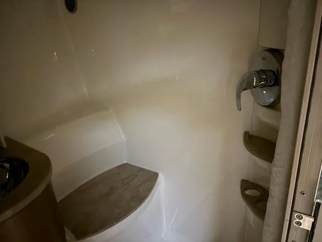 Slide: The Image of Interior of 2015 Formula Boats 400 Super Sport bathroom with shower and seating area. - 18