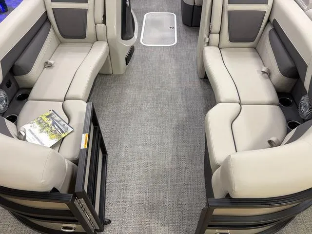 Slide: The Image of Interior of 2025 Barletta Boats C22M with beige seating and carpeted flooring. - 3