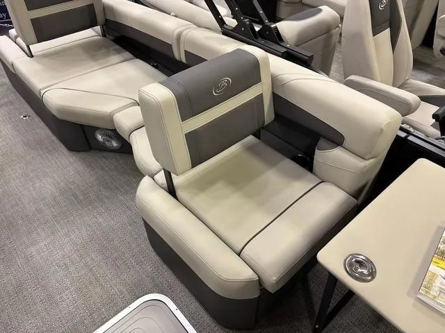 Slide: The Image of 2025 Barletta Boats C22M interior seating with beige and gray upholstery. - 5