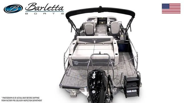 Slide: The Image of 2025 Barletta Boats C22UC pontoon with seating, motor, and American flag. - 5