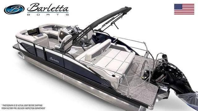 Slide: The Image of 2025 Barletta Boats C22UC pontoon with sleek design and modern features, displayed with American flag. - 6