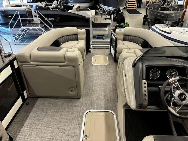 Slide: The Image of 2024 Barletta Lusso L23UC boat interior with luxurious seating and modern dashboard. - 3