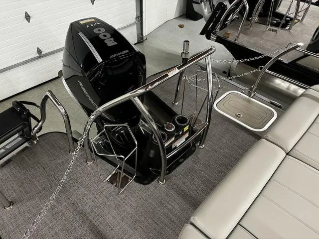 Slide: The Image of 2024 Barletta Lusso L23UC boat interior with Mercury outboard motor and seating. - 8