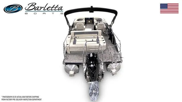 Slide: The Image of 2024 Barletta Aria A22UC pontoon boat, rear view, with seating and motor, USA flag. - 4