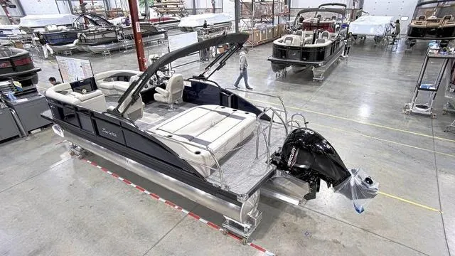 Slide: The Image of 2024 Barletta Aria 22UC pontoon boat in a manufacturing facility. - 2