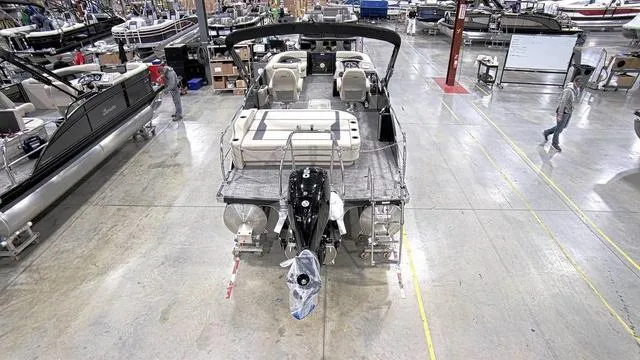 Slide: The Image of 2024 Barletta Aria 22UC boat in a manufacturing facility, rear view. - 3