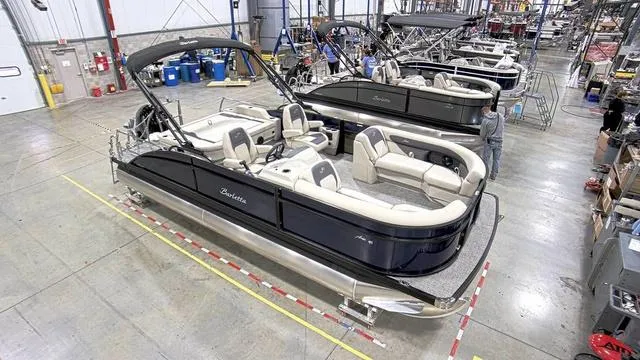 Slide: The Image of 2024 Barletta Aria 22UC pontoon boat in a manufacturing facility. - 4