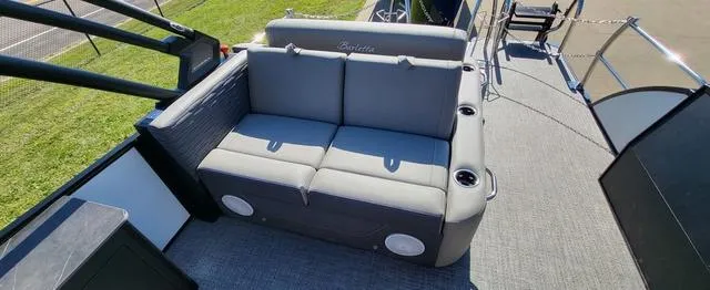 Slide: The Image of 2024 Barletta Corsa 25UEA boat with gray seating and cup holders on deck. - 7