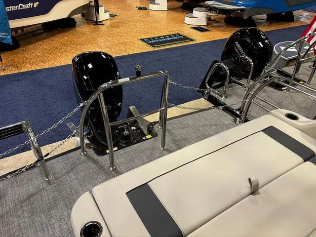 Slide: The Image of 2024 Barletta Aria A22UC boat interior with dual motors and seating area. - 8