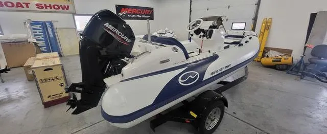 Slide: The Image of 2024 Walker Bay Venture 14 boat with Mercury engine in showroom. - 3