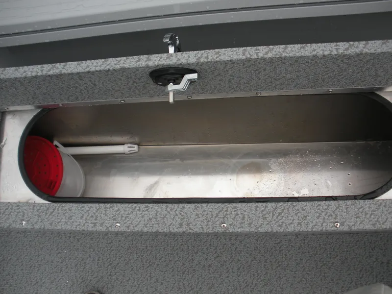 Slide: The Image of 2024 Smoker Craft Freedom 180 SC boat storage compartment with latch and bucket. - 10