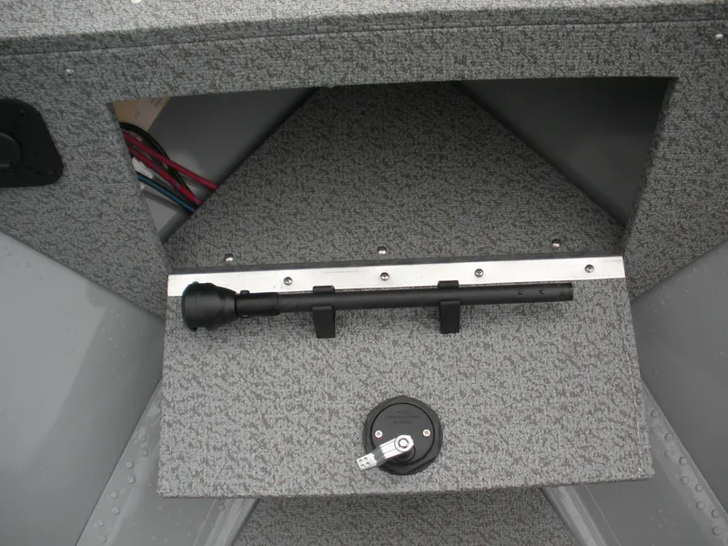 Slide: The Image of 2024 Smoker Craft Freedom 180 SC boat interior storage compartment with wiring and latch. - 4