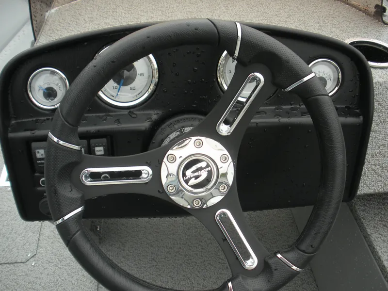 Slide: The Image of Steering wheel and dashboard of 2024 Smoker Craft Freedom 180 SC boat. - 7