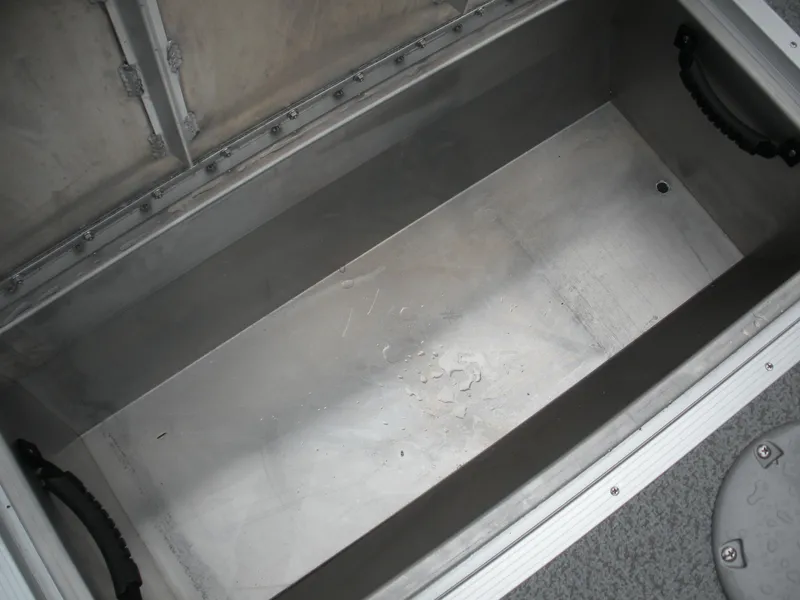 Slide: The Image of 2024 Smoker Craft Freedom 180 SC storage compartment, featuring durable metal construction and handles. - 8