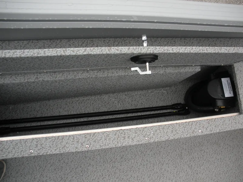 Slide: The Image of 2024 Smoker Craft Freedom 180 SC boat storage compartment, featuring a sleek, carpeted interior design. - 9