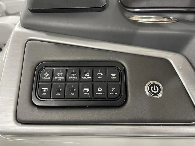 Slide: The Image of Control panel of 2025 Ranger 220FC boat with various function buttons. - 15