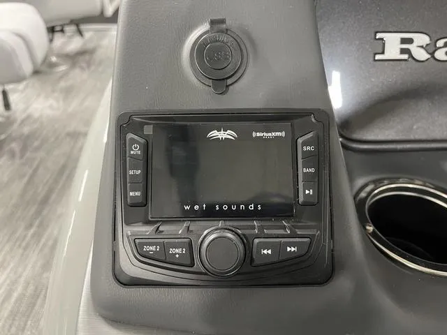 Slide: The Image of 2025 Ranger 220FC boat console with Wet Sounds audio system and cup holder. - 16