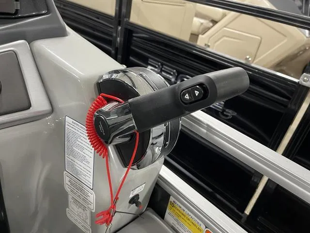 Slide: The Image of Throttle control of 2025 Ranger 220FC boat with safety lanyard attached. - 18