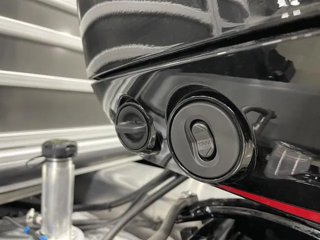 Slide: The Image of Close-up of 2025 Ranger 220FC boat engine trim controls. - 19