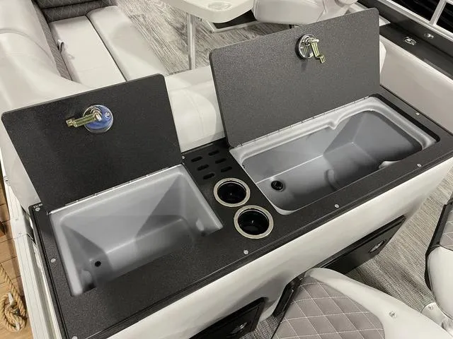 Slide: The Image of Ranger 220FC 2025 boat interior with dual sinks and cup holders. - 26