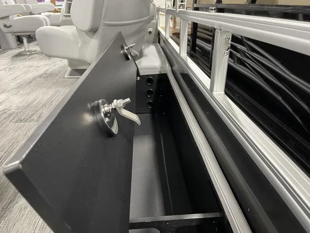 Slide: The Image of Open storage compartment in 2025 Ranger 220FC boat interior. - 30