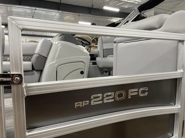 Slide: The Image of 2025 Ranger 220FC boat interior with seating and steering wheel, showcasing modern design. - 5