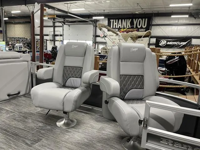 Slide: The Image of Luxurious seating on 2025 Ranger 220FC boat in showroom, featuring modern design and comfort. - 8
