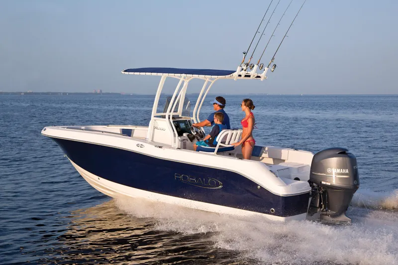 Slide: The Image of 2025 Robalo R200 boat cruising on open water with passengers. - 1
