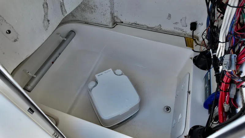 Slide: The Image of 2021 Sea Fox 248 Commander boat interior with portable toilet and wiring. - 11