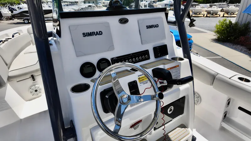 Slide: The Image of 2021 Sea Fox 248 Commander boat console with Simrad electronics and steering wheel. - 13