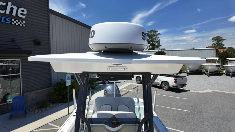 Slide: The Image of 2021 Sea Fox 248 Commander boat with radar, parked outdoors near dealership. - 17