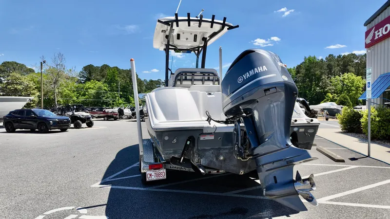 Slide: The Image of 2021 Sea Fox 248 Commander boat with Yamaha engine in a parking lot. - 2