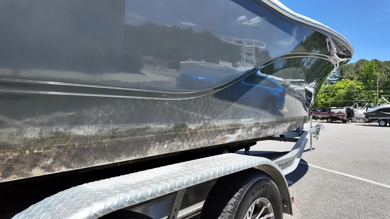 Slide: The Image of 2021 Sea Fox 248 Commander boat on trailer, side view, in a parking lot. - 21