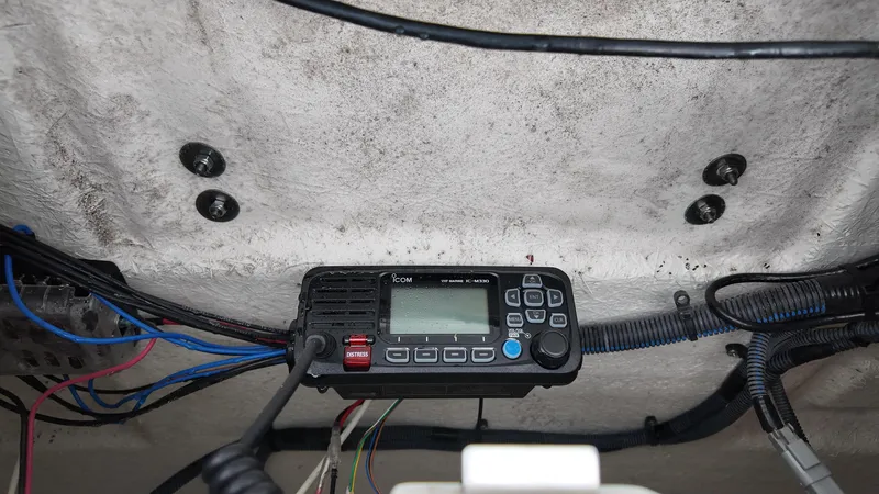 Slide: The Image of VHF radio installation on a 2021 Sea Fox 248 Commander boat, showing wiring and control panel. - 22