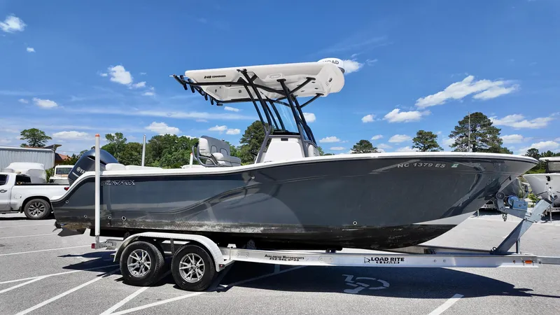 Slide: The Image of 2021 Sea Fox 248 Commander boat on trailer under clear blue sky. - 3