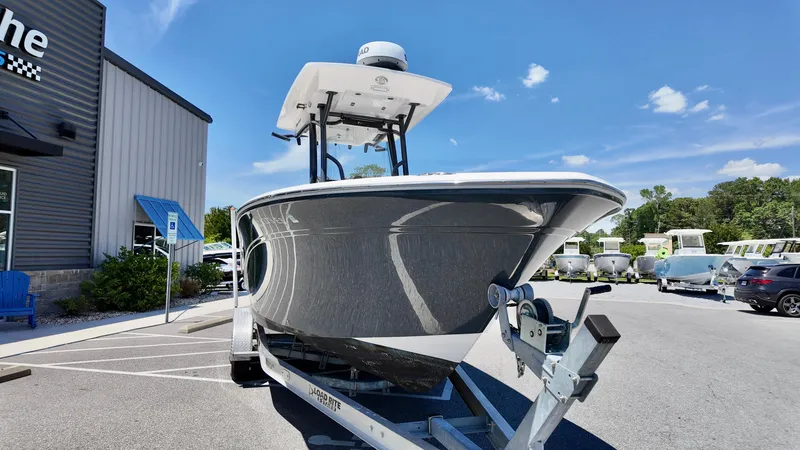 Slide: The Image of 2021 Sea Fox 248 Commander boat on trailer, parked outdoors under clear blue sky. - 4