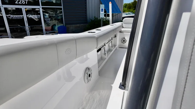 Slide: The Image of 2021 Sea Fox 248 Commander boat interior with white seating and speakers. - 5
