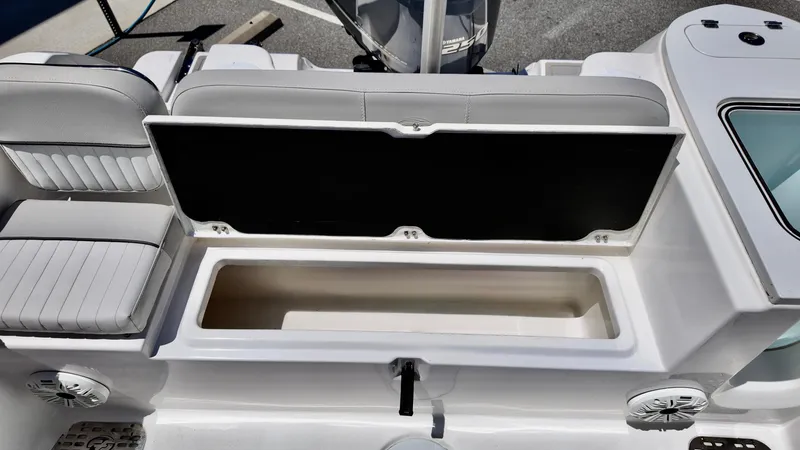 Slide: The Image of 2021 Sea Fox 248 Commander boat with open storage compartment and cushioned seating. - 7