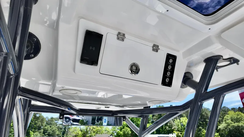 Slide: The Image of 2021 Sea Fox 248 Commander boat console with storage and controls. - 9