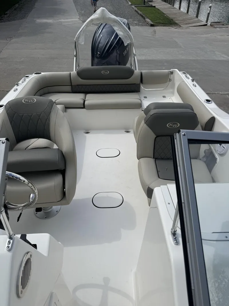 Slide: The Image of 2025 Key West 203 DFS boat interior with cushioned seating and modern design. - 10