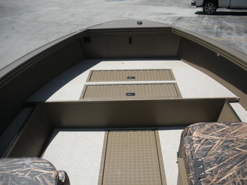 Slide: The Image of 2024 Smoker Craft Pro Sportsman 1872 T boat interior with storage compartments. - 2