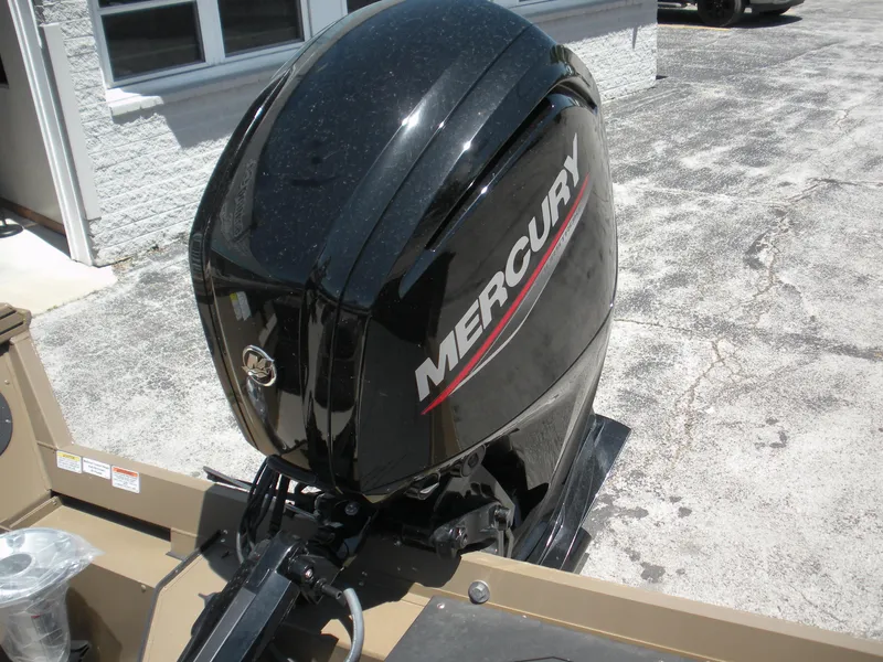 Slide: The Image of 2024 Smoker Craft Pro Sportsman 1872 T with Mercury outboard motor, outdoor setting. - 4