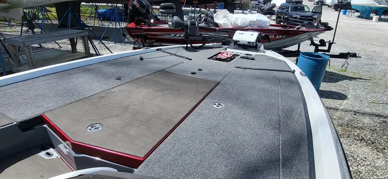 Slide: The Image of 2021 Vexus VX20 boat with spacious deck, parked outdoors. - 10