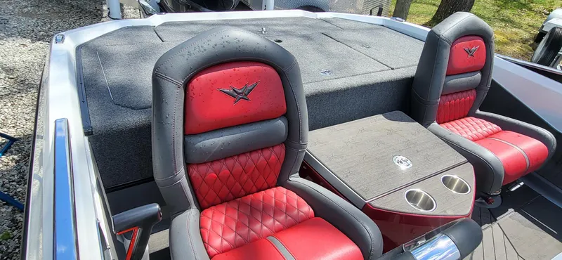 Slide: The Image of 2021 Vexus VX20 boat interior with red and black seats and a central console. - 11