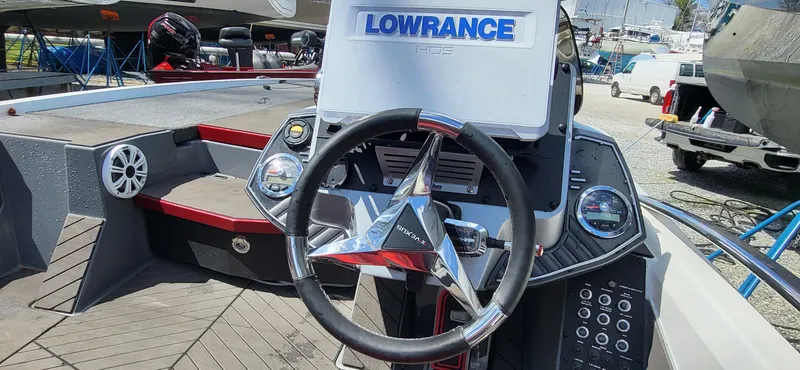 Slide: The Image of 2021 Vexus VX20 boat dashboard with Lowrance electronics and steering wheel. - 12