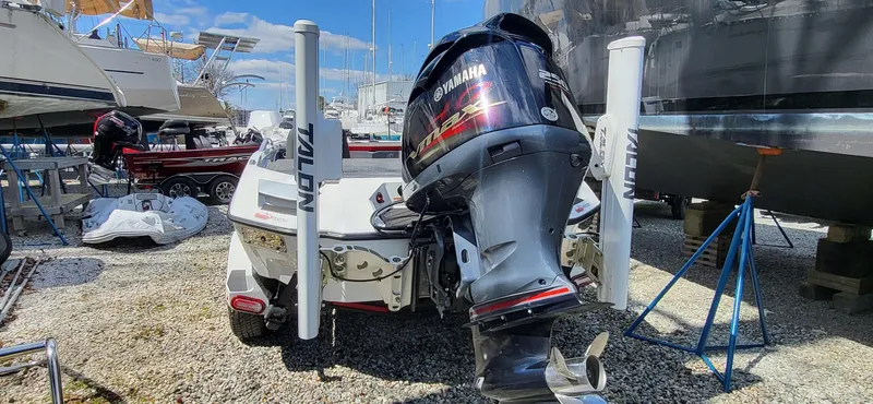 Slide: The Image of 2021 Vexus VX20 boat with Yamaha outboard motor in a marina setting. - 5