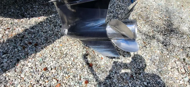 Slide: The Image of 2021 Vexus VX20 boat propeller on gravel surface, casting shadows. - 6